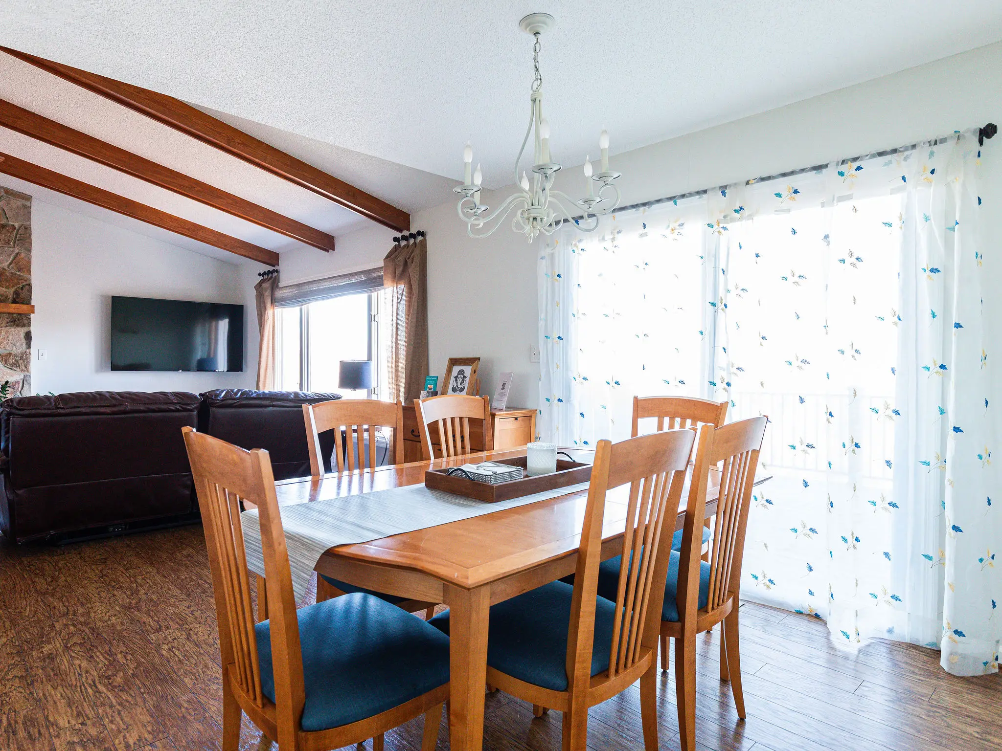 Dining table for six beside sliding doors
