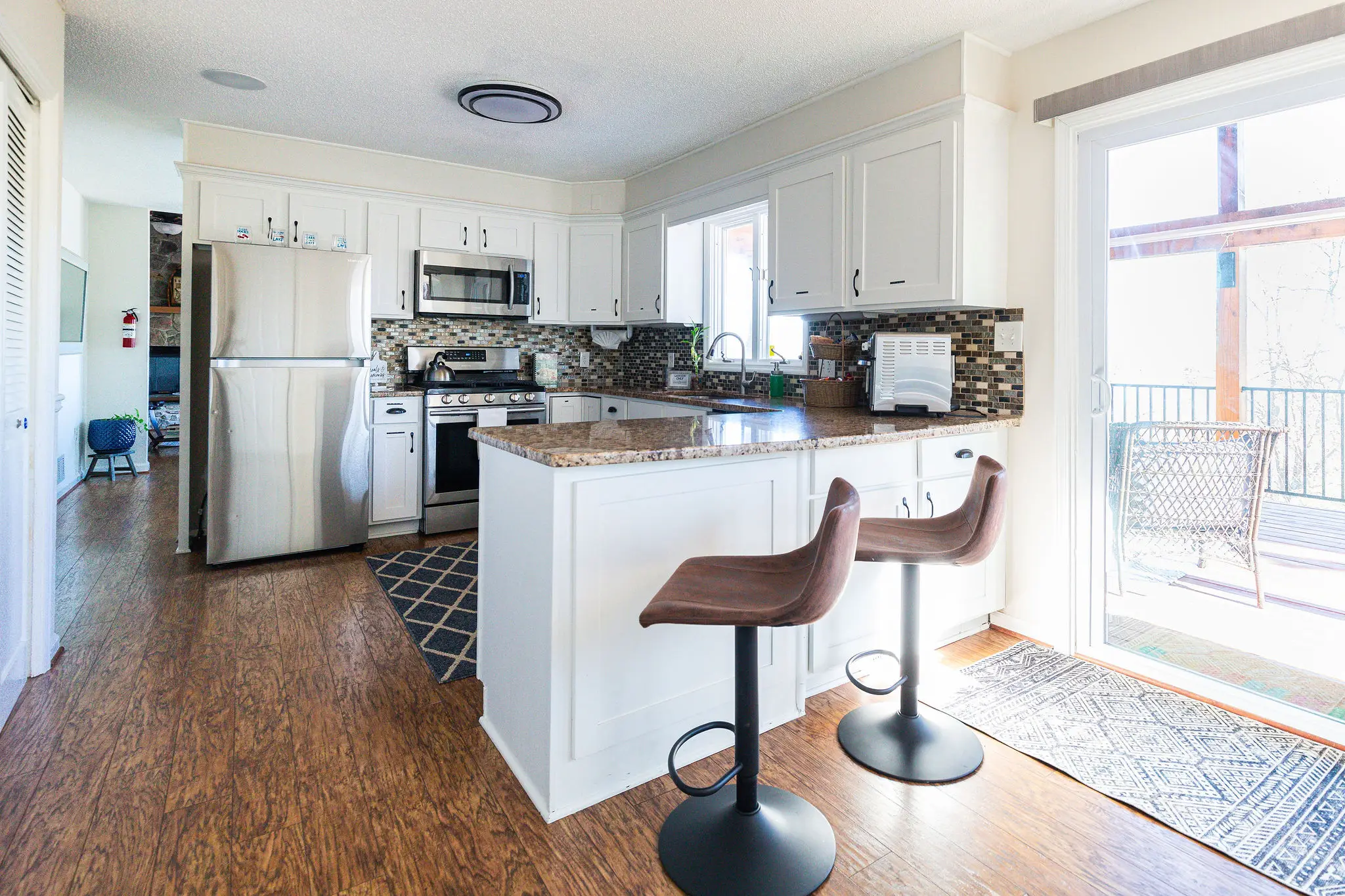 Kitchen island with two bar stools