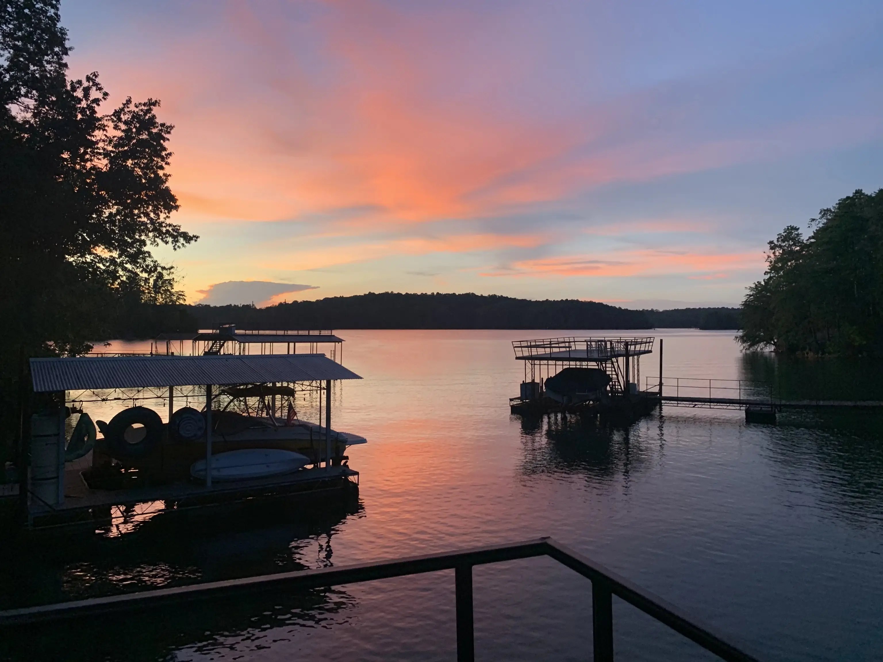Pink summer sunset over Lake Lanier and the neighboring docks